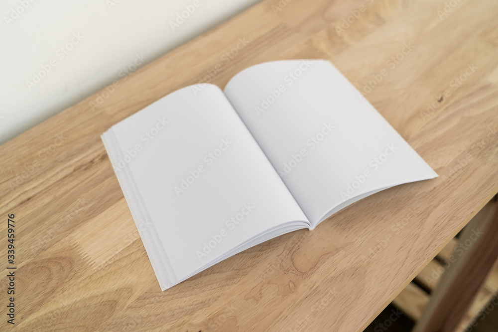Fototapeta premium Blank catalog, magazines, book on wood background.