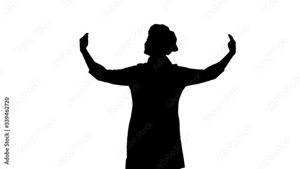 Portrait of black silhouette of cook girl raising hands and head up.