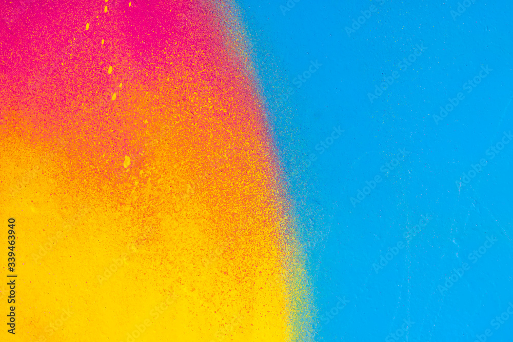 Naklejka premium Beautiful bright colorful street art graffiti background. Abstract creative spray drawing fashion colors on the walls of the city. Urban Culture, yellow ,green , sunny, salad , light texture