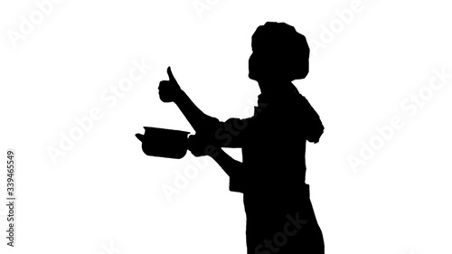 Portrait of black silhouette of a chef female in uniform smelling dish and showing like sign.
