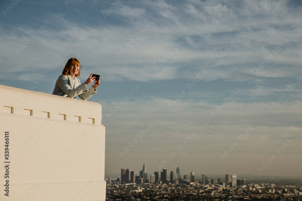 Woman capturing LA scenery