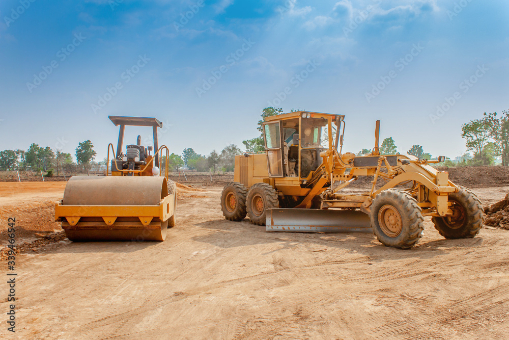 Motor grader and Vibratory roller compactor working in site