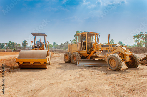 Print op canvas Motor grader and Vibratory roller compactor working in site construction