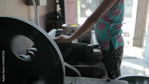 Burmese factory workers producing handmade fish crisps photo