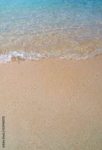Waves against sandy beach in summer © Eva Almqvist