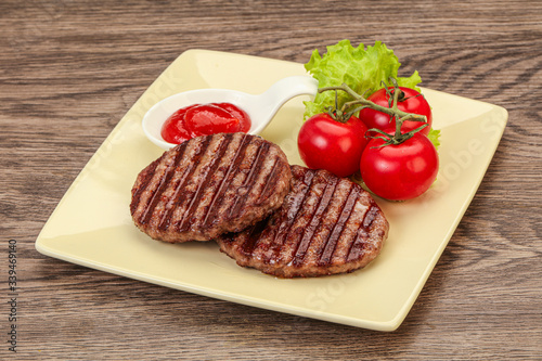 Grilled burger cutlet with sauce