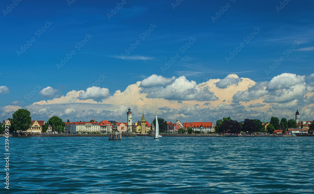 The Lindau embankment, the New lighthouse, the Bavarian lion and the Mangturm tower. lake Constance. Germany. Soft focus, blurry background.