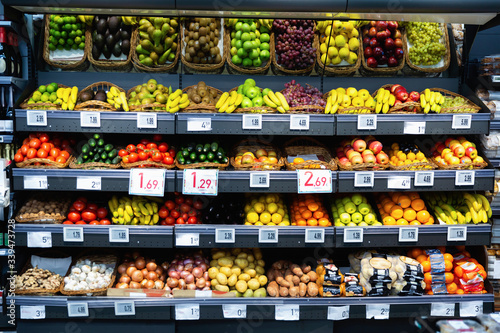 Raw fresh vegetables and fruits assortment on counter © JackF