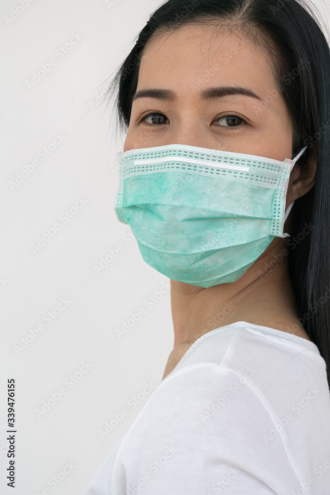 A woman wears a face mask that protects against the spread of Coronavirus (COVID-19).