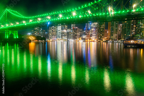 Brisbane CBD reflecting off the Brisbane River underneath the Story Bridge