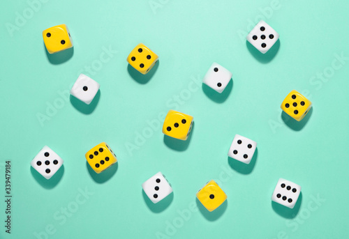 Randomly scattered yellow and white dice