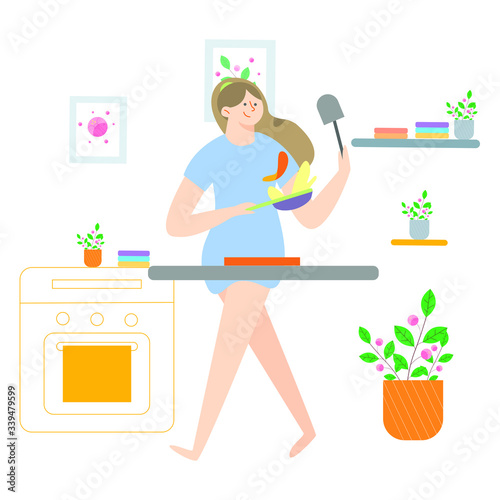Young women at home cooking in period of self isolation and social distancing during covid virus epidemic. 