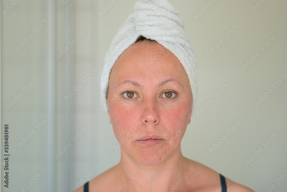 Hispanic woman with hair in a towel Hispanic woman with hair in a towel