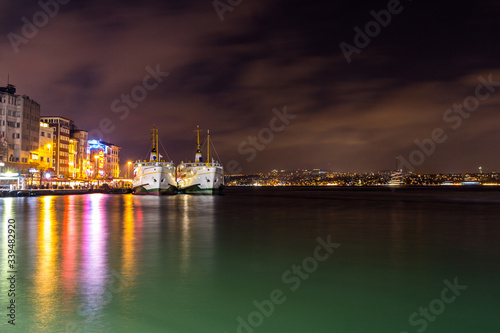 Two ferries on the pier at night in Istanbul. Turkey