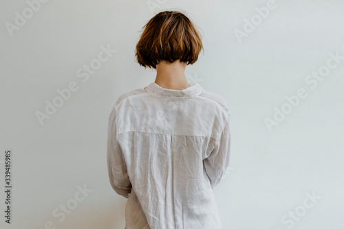 Woman in a white linen shirt