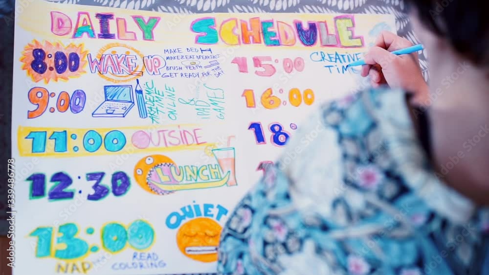 Home education COVID 19. Creative time in hand made colorful daily schedule. Blue pencil. Lockdown, isolation and social distancing has changed our daily routines and lifestyle. Home education COVID 19. Creative time in hand made colorful daily schedule. Blue pencil. Lockdown, isolation and social distancing has changed our daily routines and lifestyle.