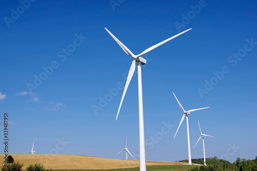 Low angle view of wind turbines in the countryside