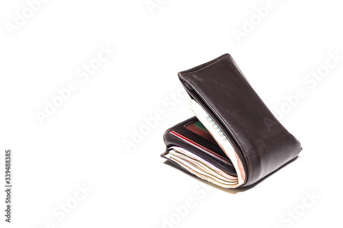 Picture concept with finance and banking. Brown leather wallet with money isolated on white background