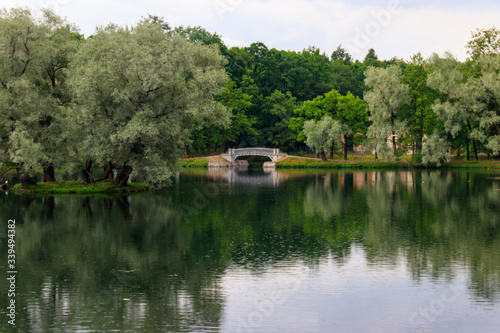 Lake with old bridge in a park in Gatchina, Russia
