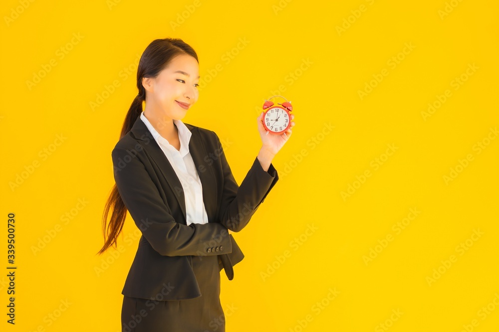 Portrait beautiful young asian woman show clock or alarm Portrait beautiful young asian woman show clock or alarm