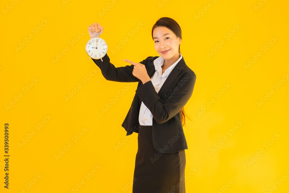 Portrait beautiful young asian woman show clock or alarm Portrait beautiful young asian woman show clock or alarm