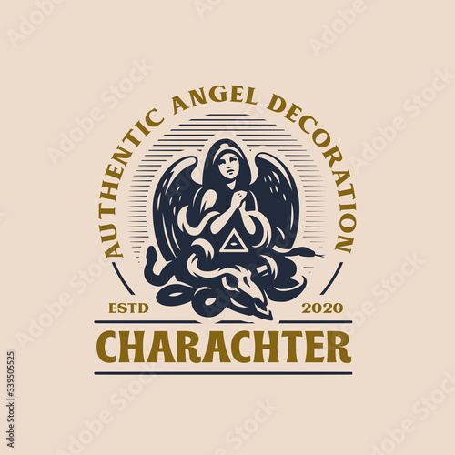 Woman angel in a hood and with wings prays.