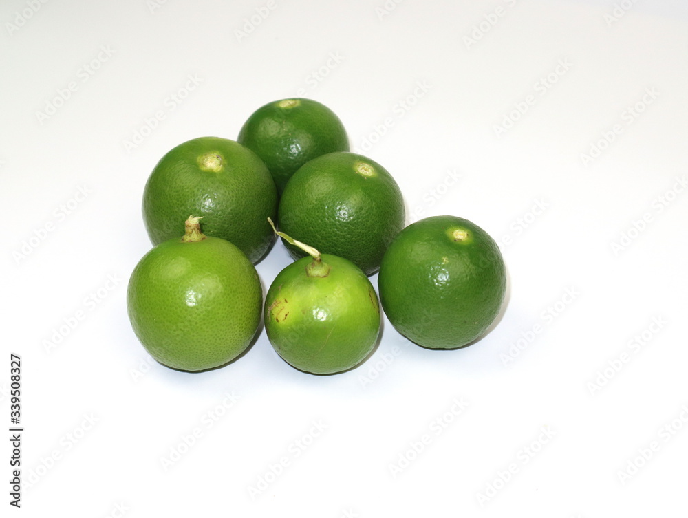 Fresh green lemons from the garden Isolated on a white background. Fresh green lemons from the garden Isolated on a white background.
