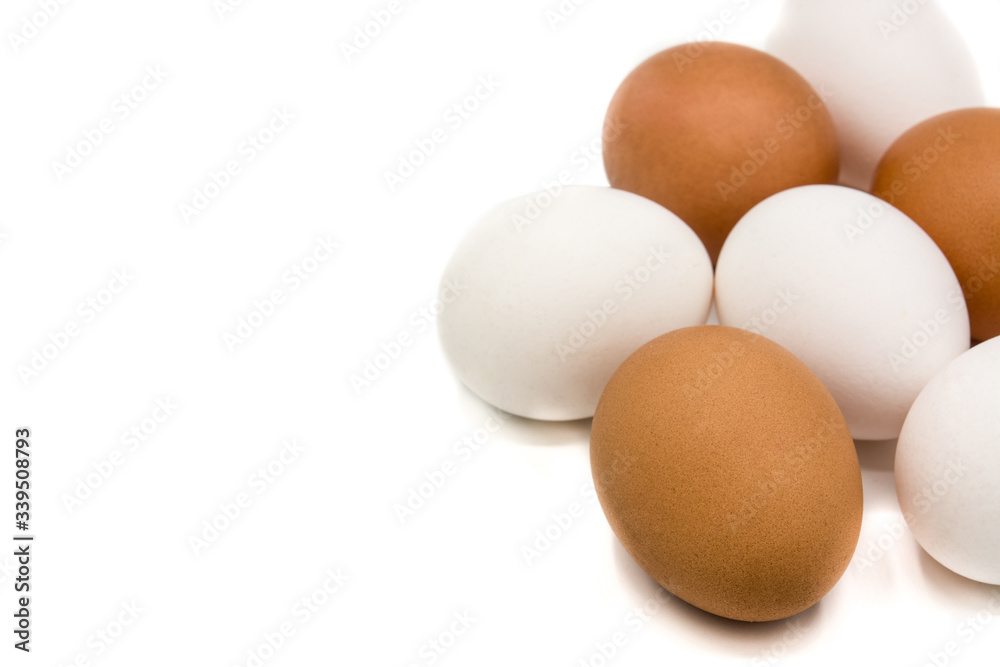 Brown and white eggs isolated on white background. Copy space Brown and white eggs isolated on white background. Copy space