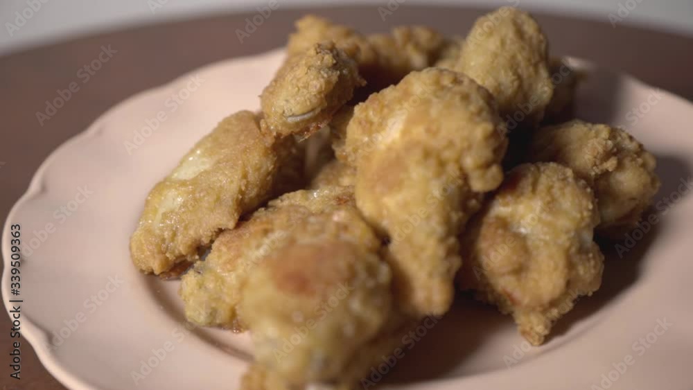 Crispy and Juicy Fried Chicken Wings on a Plate- Close up Shot Crispy and Juicy Fried Chicken Wings on a Plate- Close up Shot
