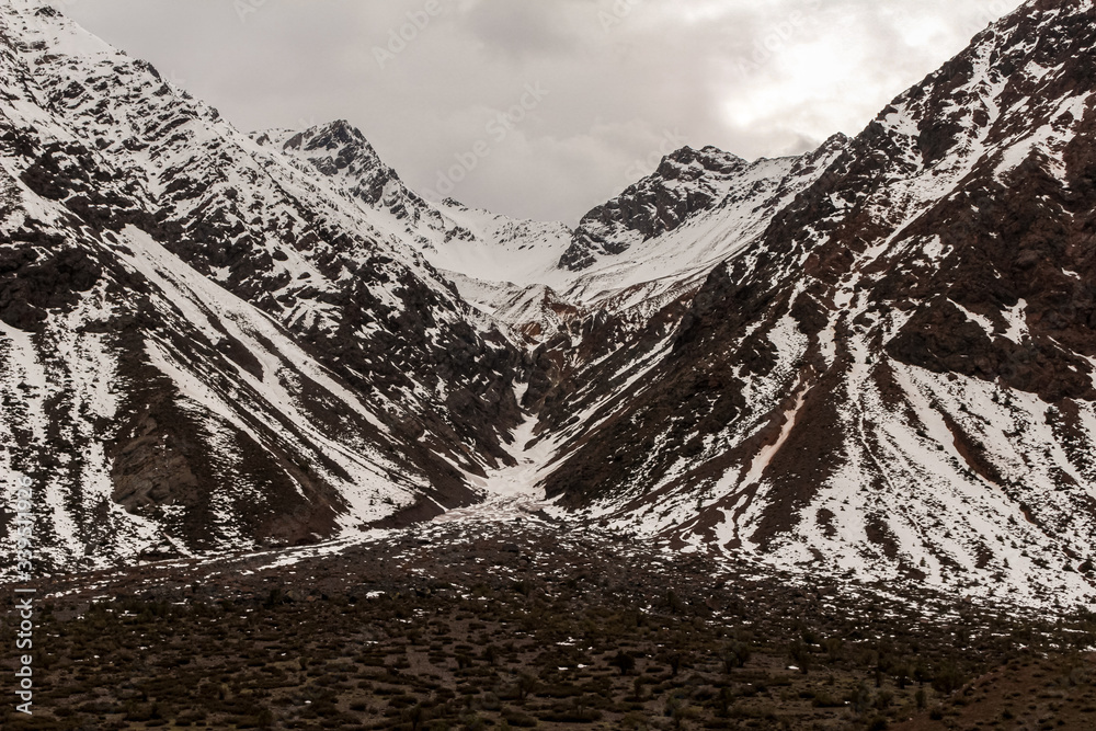 Mountain landscape during winter in Lo Valdés Valley, Cajón del Maipo, Central Andes of Chile.