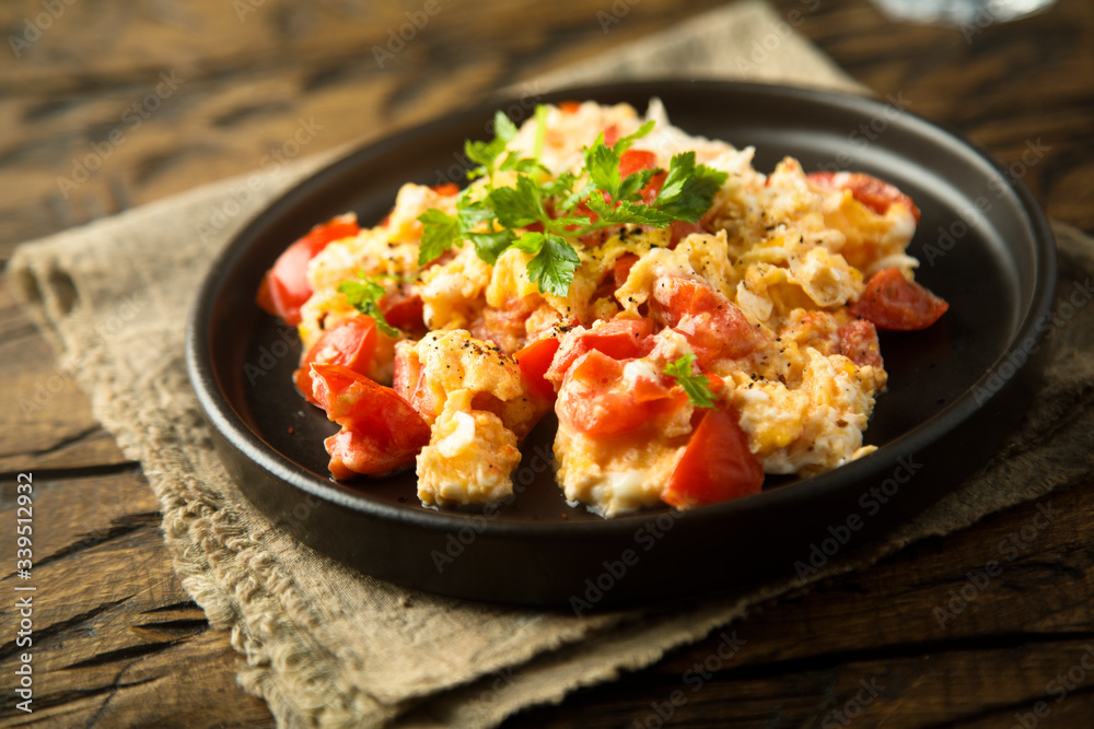 Homemade omelette with tomato and herbs Homemade omelette with tomato and herbs