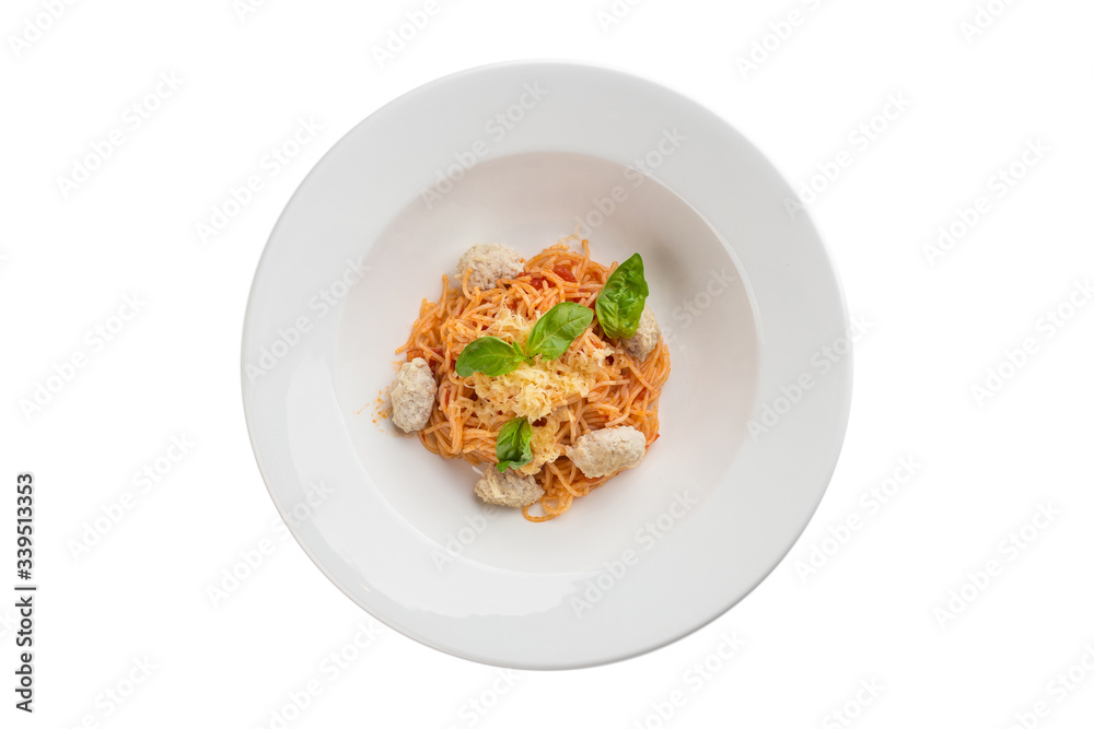 Chicken meatballs with pasta and tomato sauce on white plate isolated on white background Chicken meatballs with pasta and tomato sauce on white plate isolated on white background