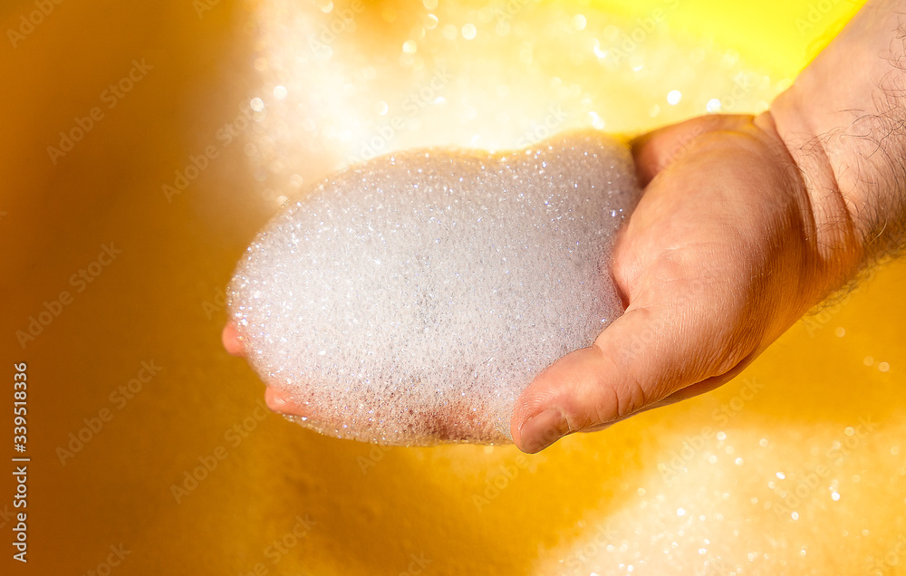 Fototapeta premium hand washing in water with soap suds