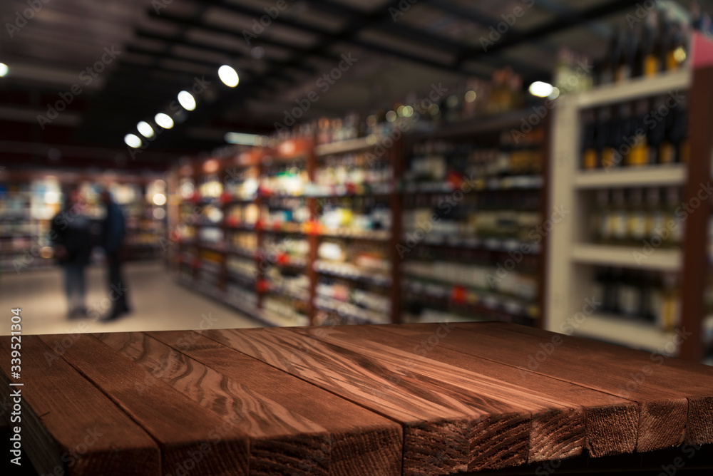Supermarket background, Counter over blur grocery background, Wooden desk, table, shelf and blur woman shopping at supermarket, Wood counter for grocery store retail product display backdrop, template
