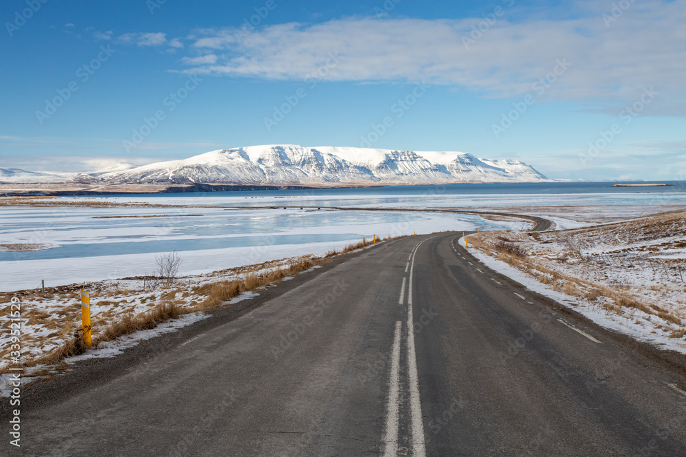 icelandic road with snow and tarmac Iceland 