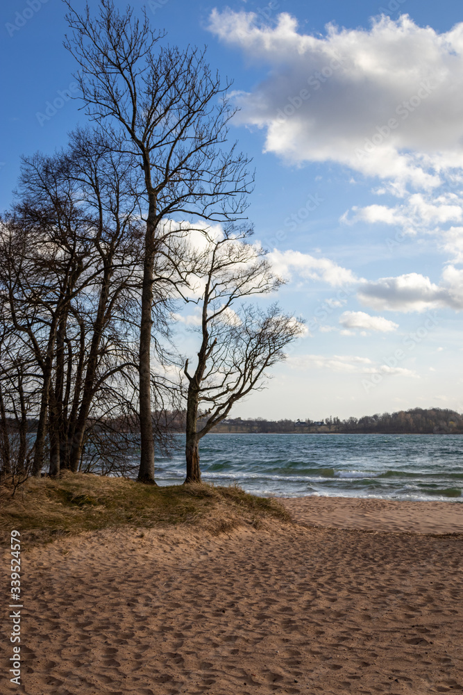 Varamon beach, Sweden, Motala on a windy spring day. Sand and waves Varamon beach, Sweden, Motala on a windy spring day. Sand and waves