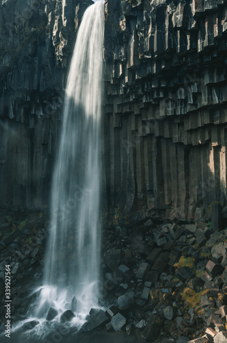 Svartifoss waterfall surrounded by dark lava columns  Iceland