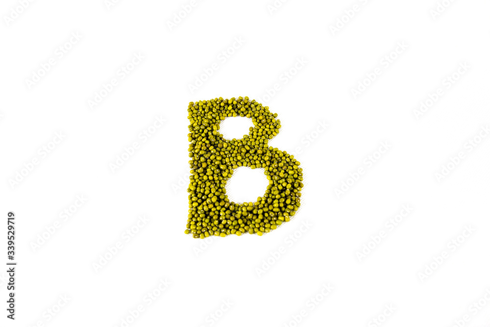 Green bean seed on white background, shaped B letter