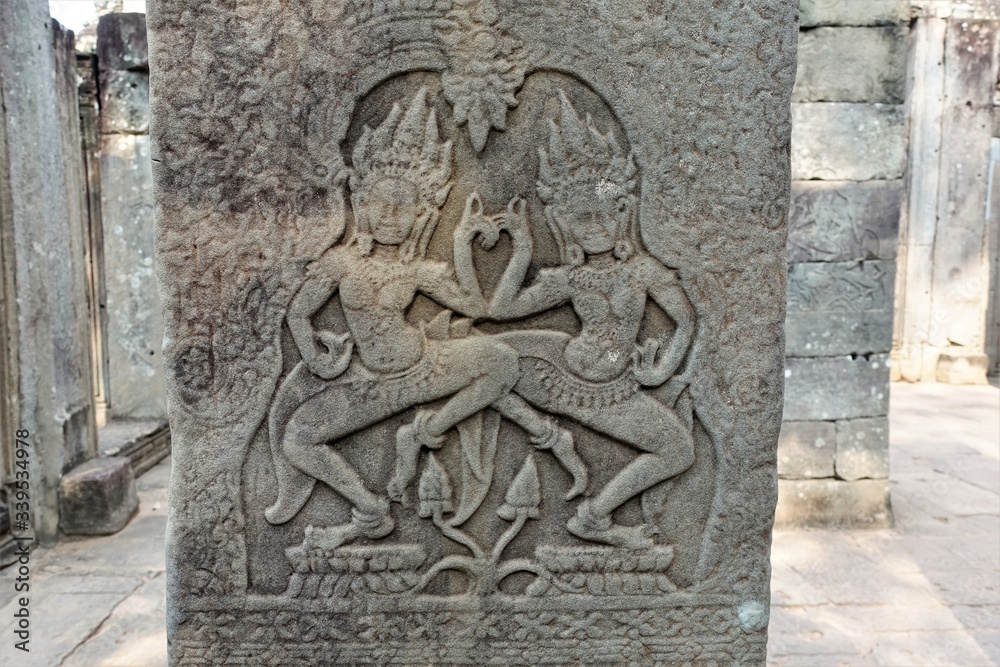 A bas-relief of expressive images of heavenly dancers is an apsar in the famous Angkor temple complex in Cambodia. Ancient and mysterious.