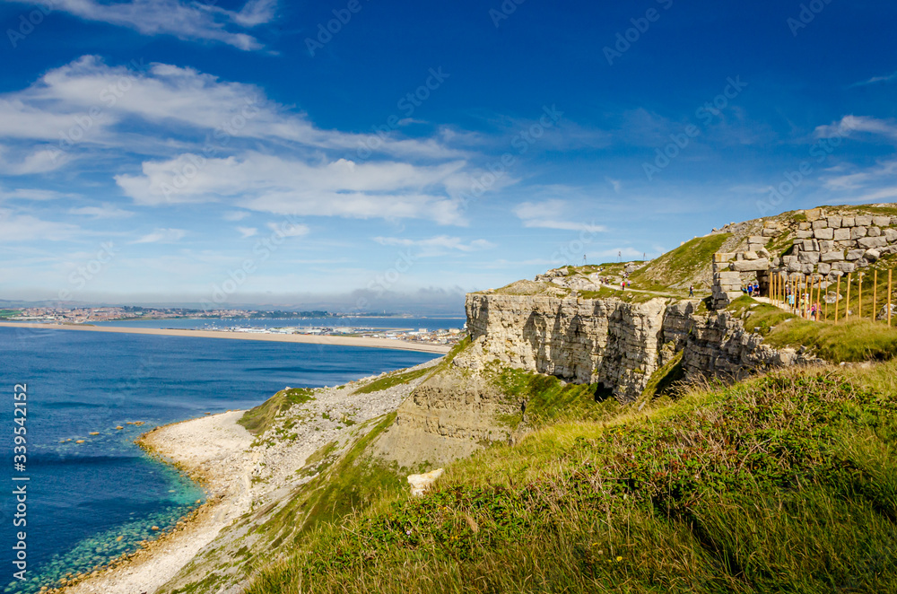 The cliffs of the Jurassic coast on the Isle of Portland, Portland, Dorset, UK on a hazy and sunny Summer morning
