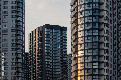 Modern and new apartment buildings. Multistoried modern, new and stylish living block of flats. Real estate. New house.Newly built block of flats