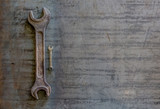 Old rusty wrench on a white and metal background. several wrenches of different sizes. Card with copy space for text