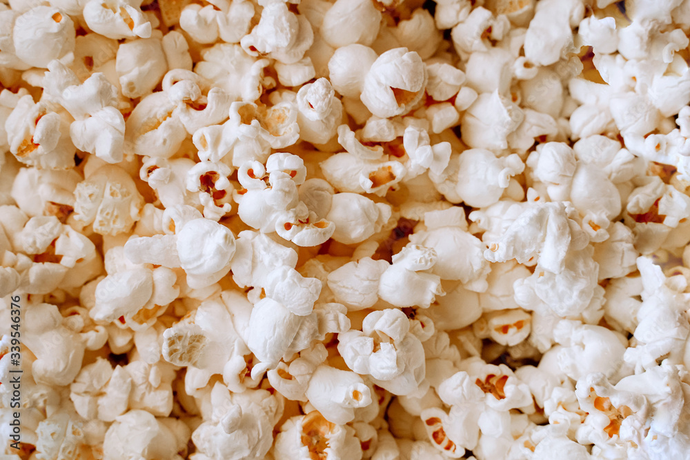 Background of yellow salted popcorn closeup. Food texture Background of yellow salted popcorn closeup. Food texture
