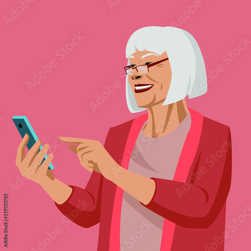 Happy old woman shopping online. Mature senior woman using smartphone.