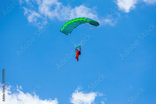 man flies on a parachute at the summer air show