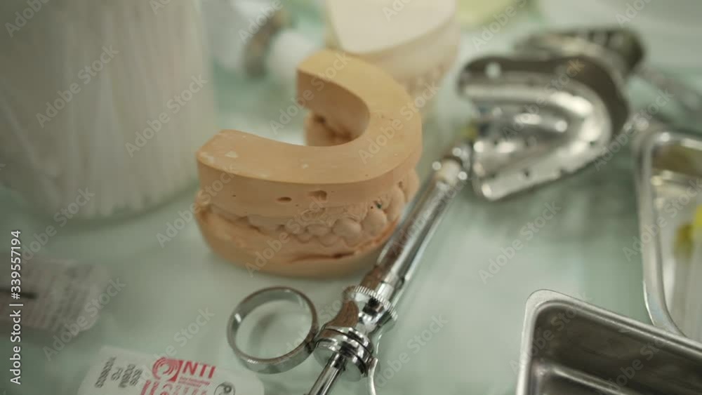 Plaster cast molds of the upper and lower jaws and teeth with a pliable ...