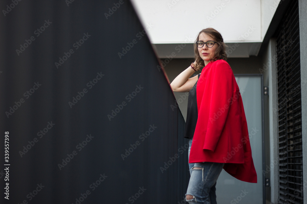 A young businesswoman thinking about something on her balcony
A young businesswoman thinking about something on her balcony
