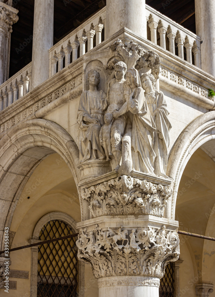 Decorative sculptures on the corner column of the Doge Palace on Piazza San Marco in Venice, Italy.