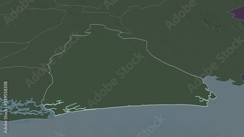 Akwa Ibom, state with its capital, zoomed and extruded on the administrative map of Nigeria in the conformal Stereographic projection. Animation 3D photo