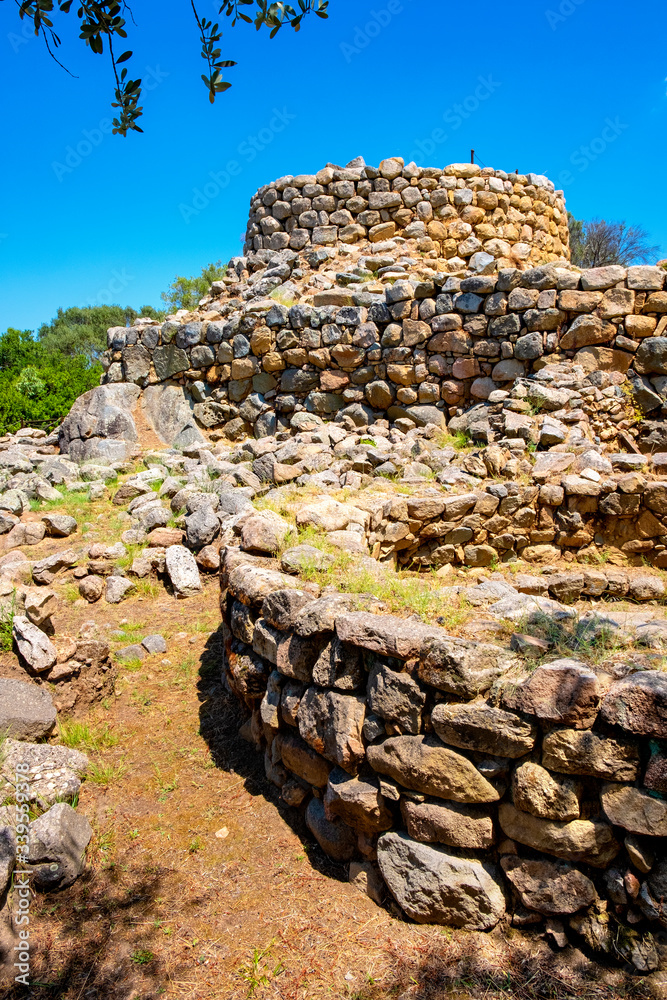 Arzachena, Sardinia, Italy -Archeological ruins of Nuragic complex La Prisgiona - Nuraghe La Prisgiona - with stone main tower and preserved remaining of Neolithic fortress